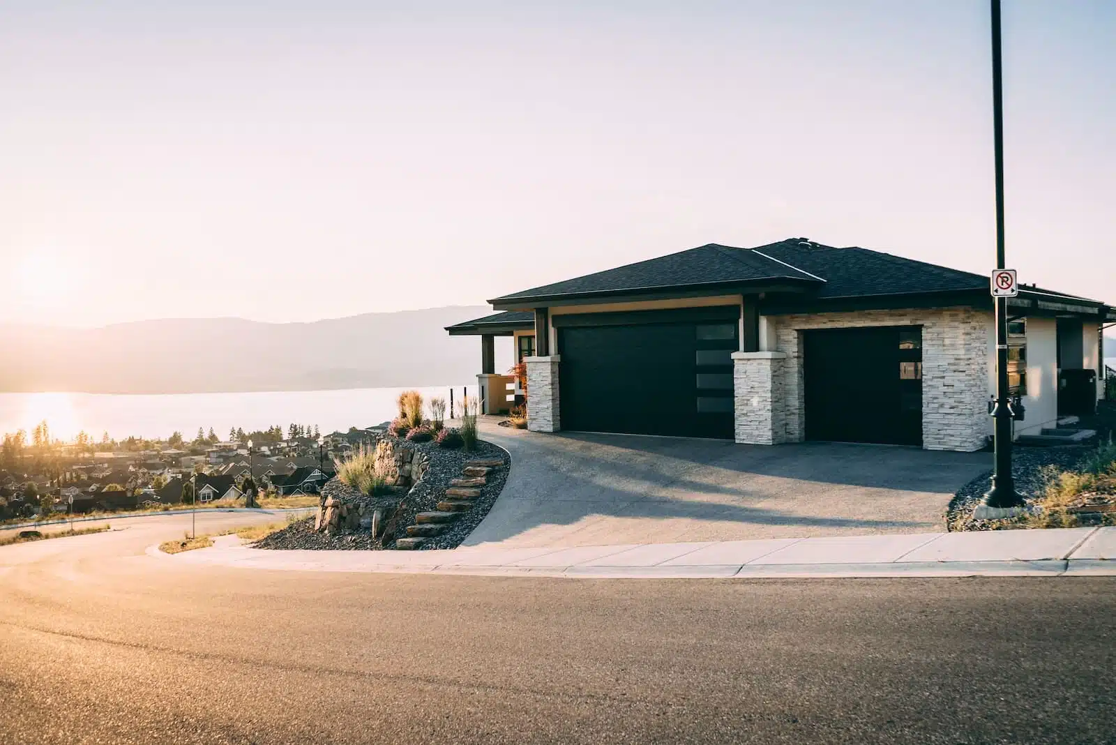 house 2 garage doors are both close during daytime